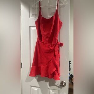 Red flowy dress with a skirt like tie feature